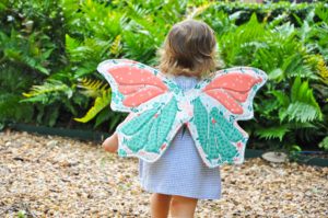 toddler girl wearing appliqued butterfly wings